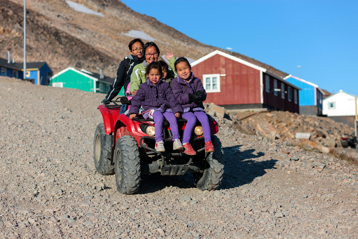 Family from Ittoqqortoormiit, Scoresby Sund, Greenland. Henk Meijer / Alamy Stock Photo